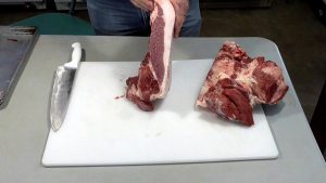 Demonstrating the end of the cut ham that looks like a slice of bacon